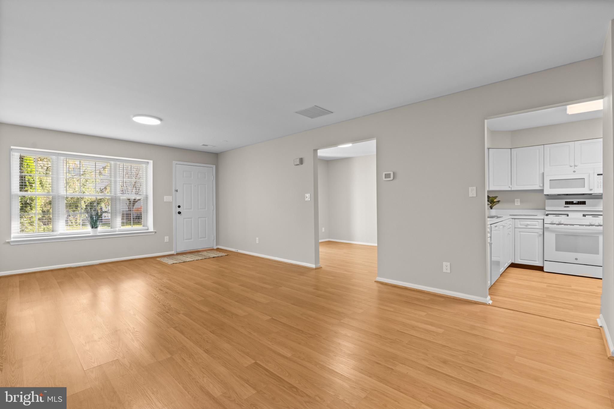 205 Kirby Way Mount Laurel, NJ 08054 - Photo 4 of 26 a view of empty room with wooden floor and window