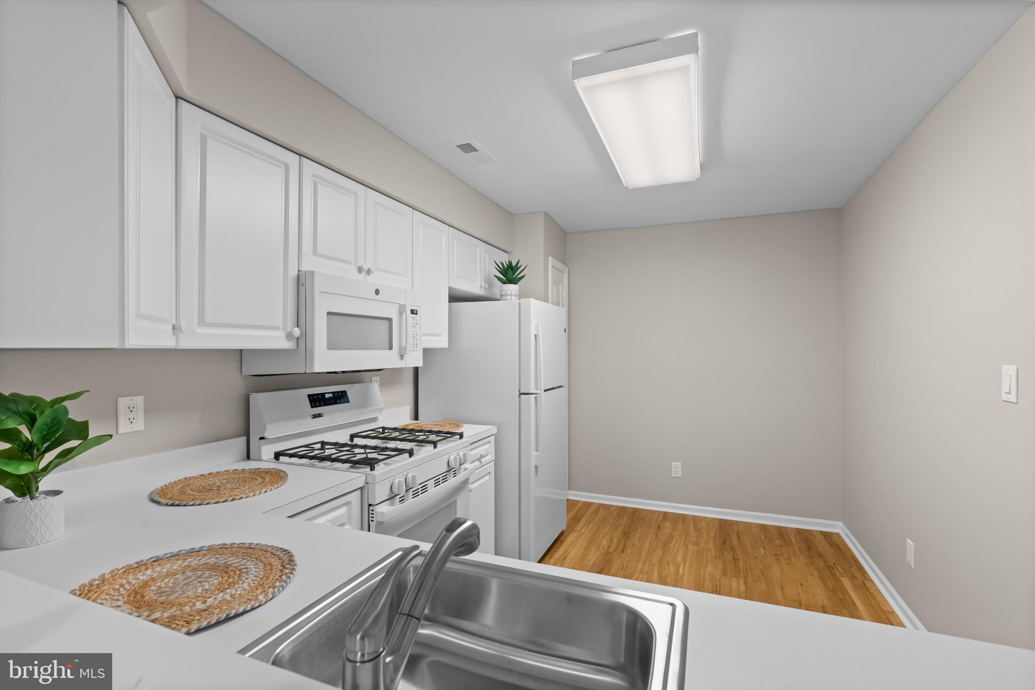 205 Kirby Way Mount Laurel, NJ 08054 - Photo 10 of 26 a kitchen that has a sink and a stove in it