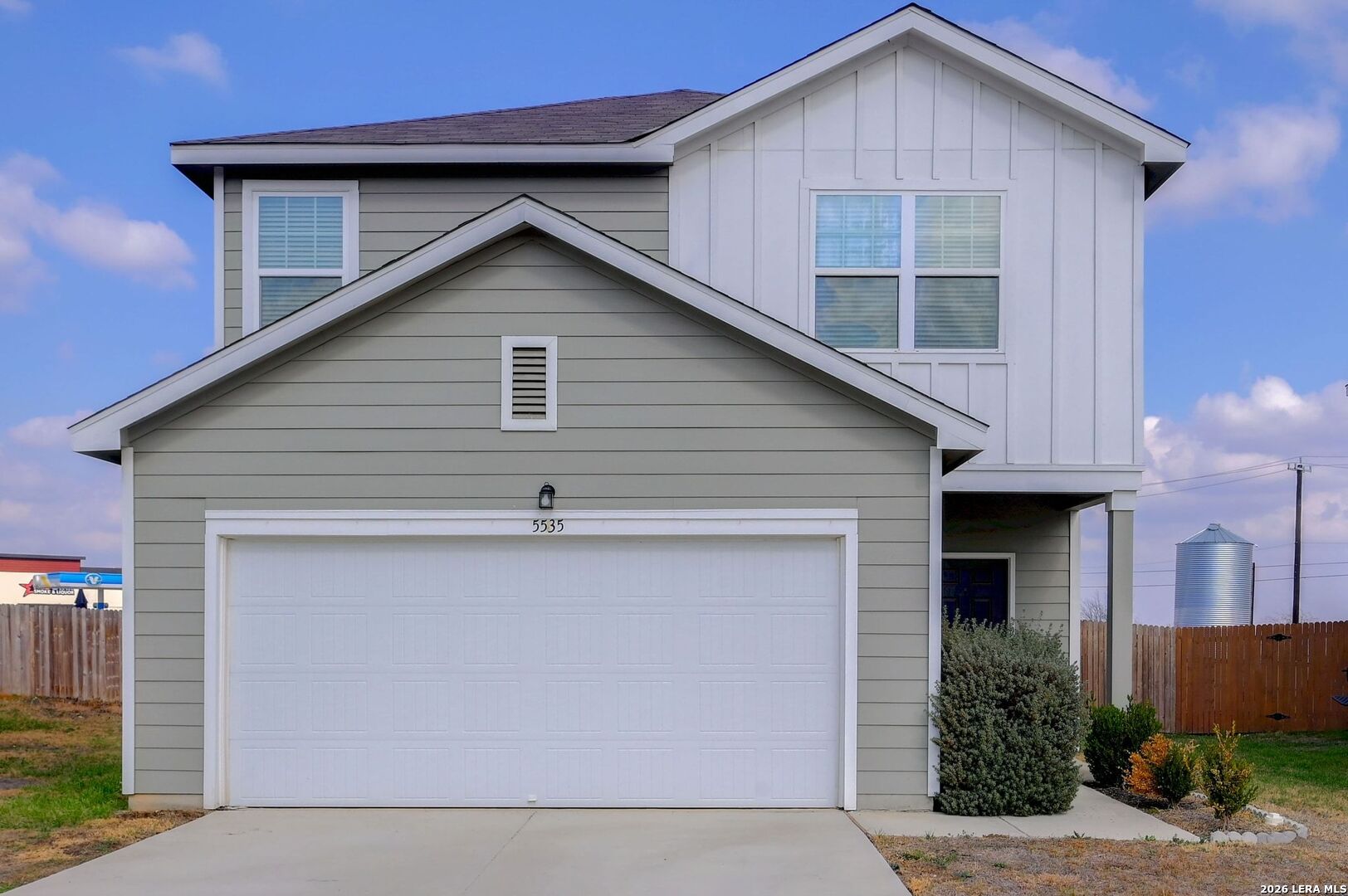 a house view with a backyard space