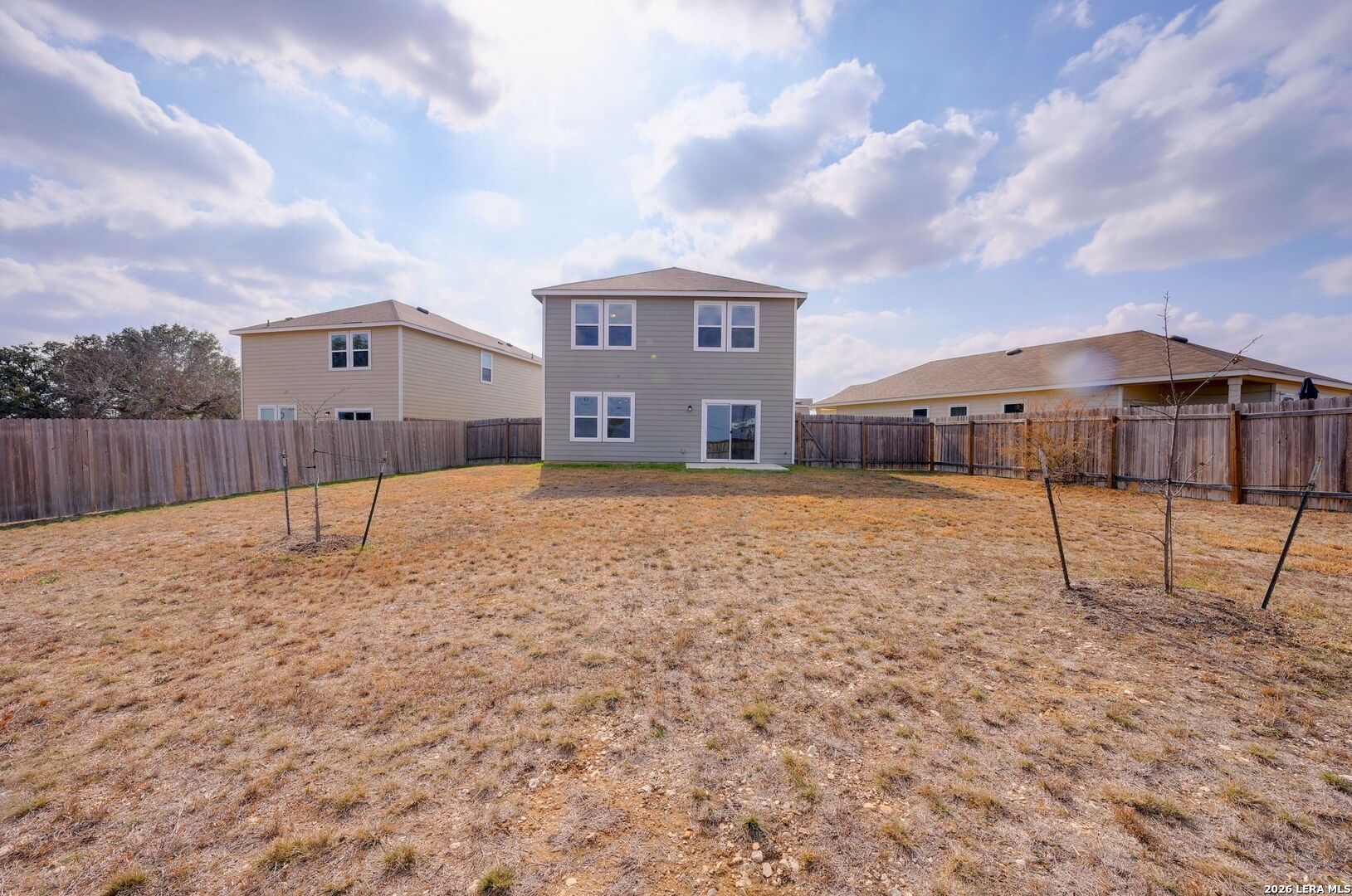 5535 Rue Girard Converse, TX 78109 - Photo 30 of 33 a large house with a big yard and large tree