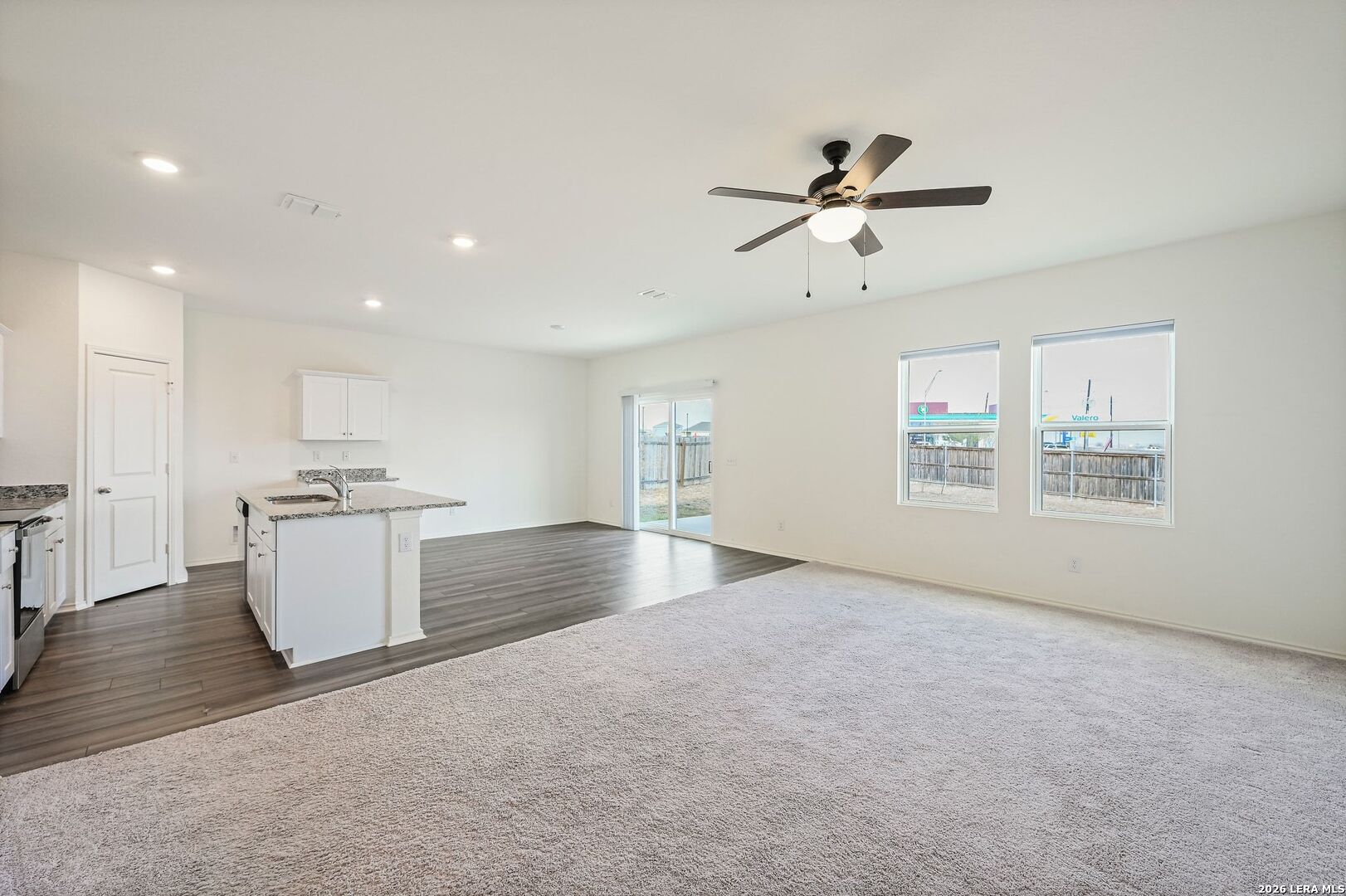 5535 Rue Girard Converse, TX 78109 - Photo 6 of 33 a view of an empty room with a window and kitchen view