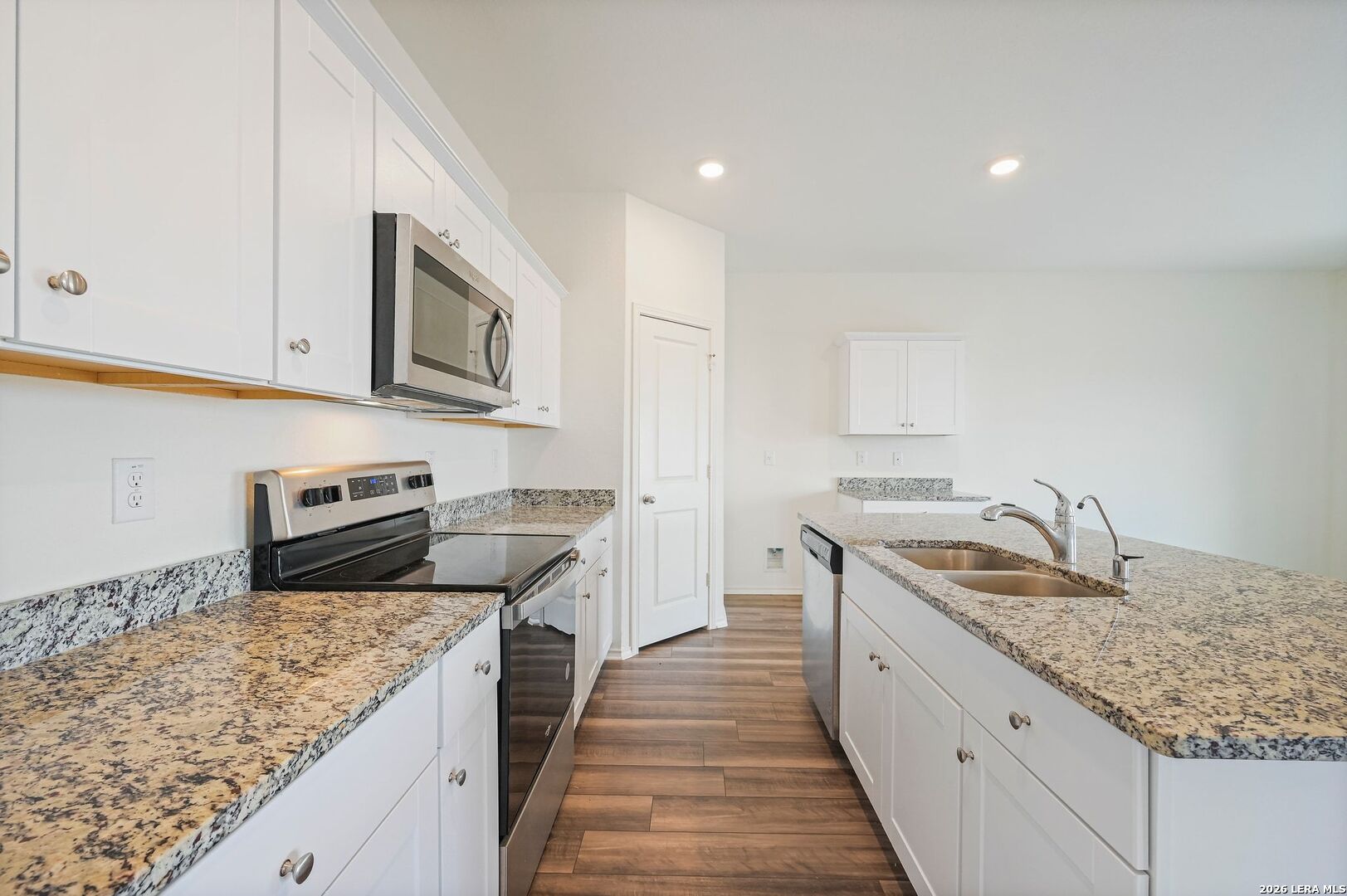 5535 Rue Girard Converse, TX 78109 - Photo 10 of 33 a kitchen with stainless steel appliances granite countertop a sink stove and refrigerator