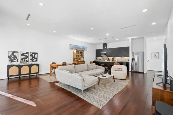 a living room with furniture and a table