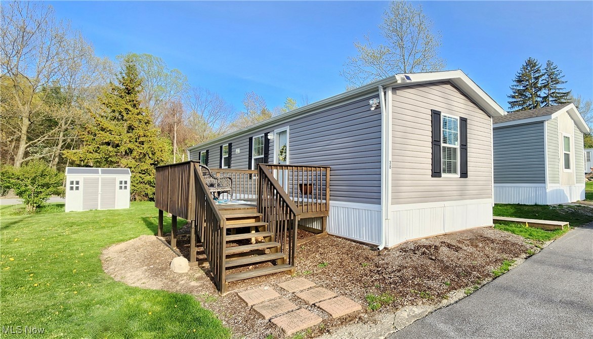 8323 Eagle Road, Unit 38 Willoughby, OH 44094 - Photo 1 of 23 Front of home with a large deck and shed.