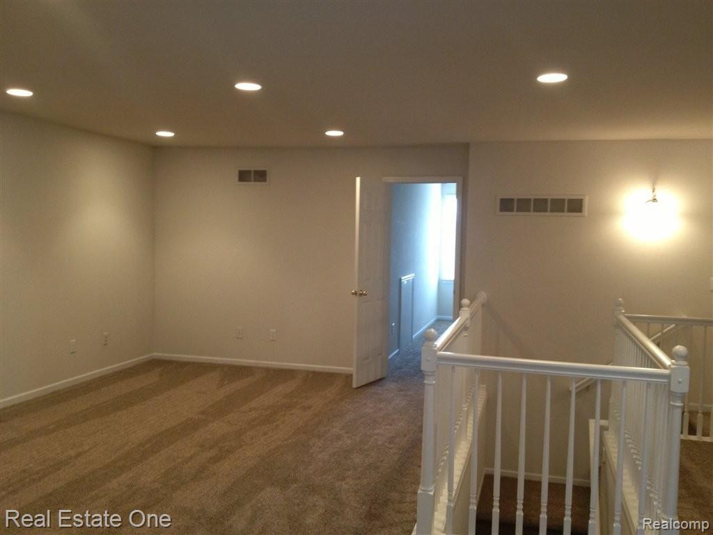 735 East Bluff Court, Unit 2 Rochester, MI 48306 - Photo 8 of 14 7 Loft upstairs with closets.JPG