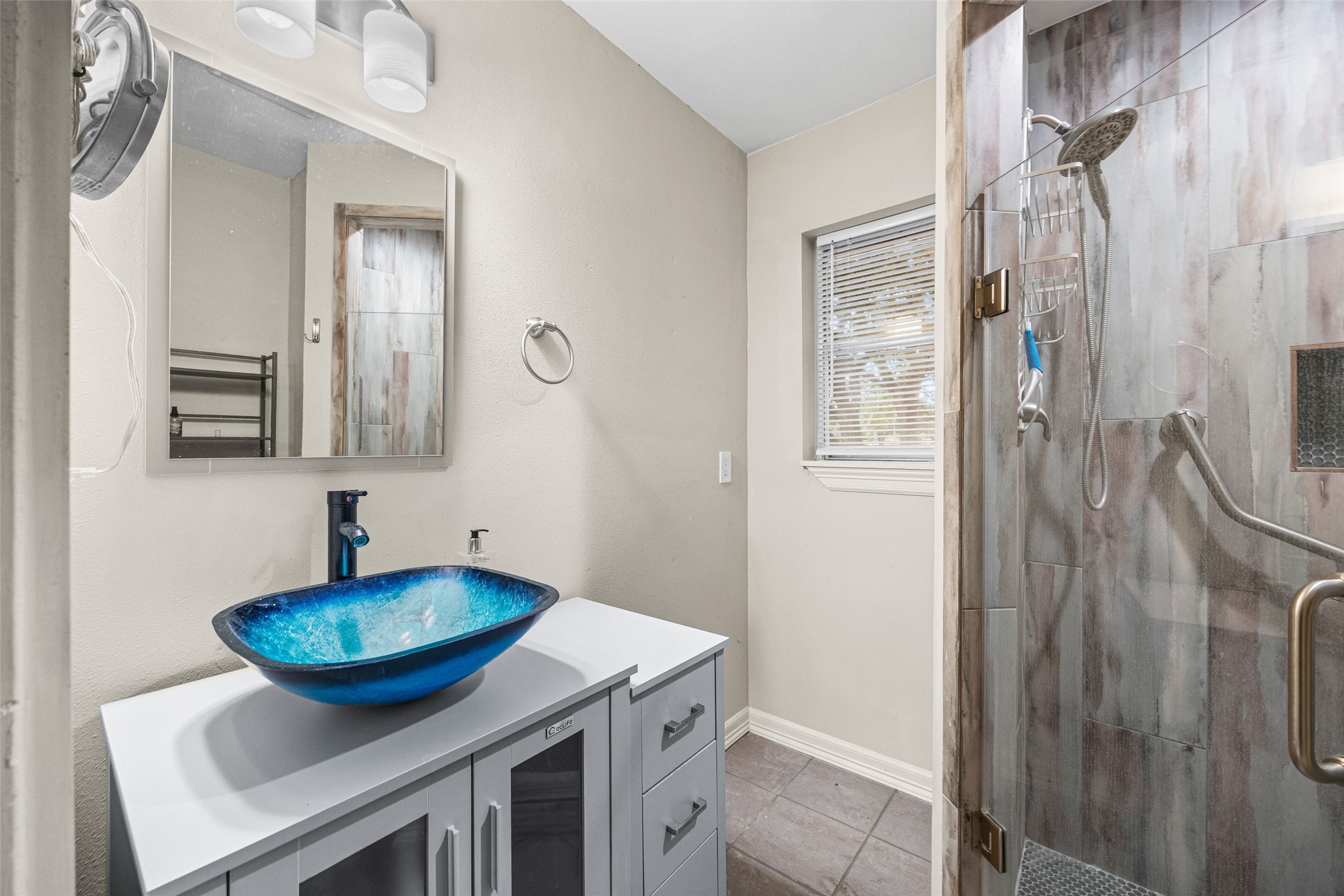 10319 Old Orchard Road La Porte, TX 77571 - Photo 13 of 19 a bathroom with a sink and a mirror