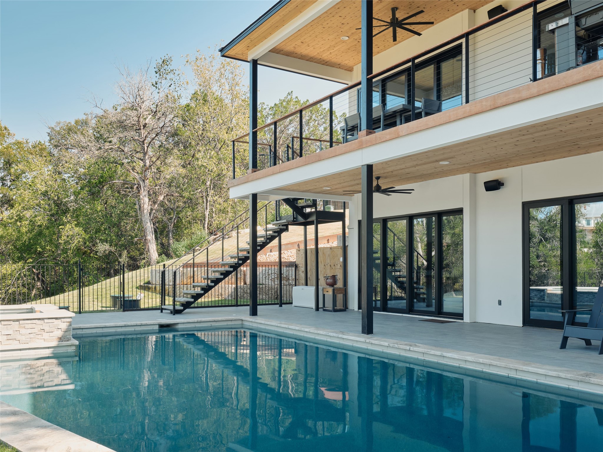 3214 Smoky Ridge, Unit LOT A Austin, TX 78730 - Photo 23 of 32 a view of a house with swimming pool and sitting area
