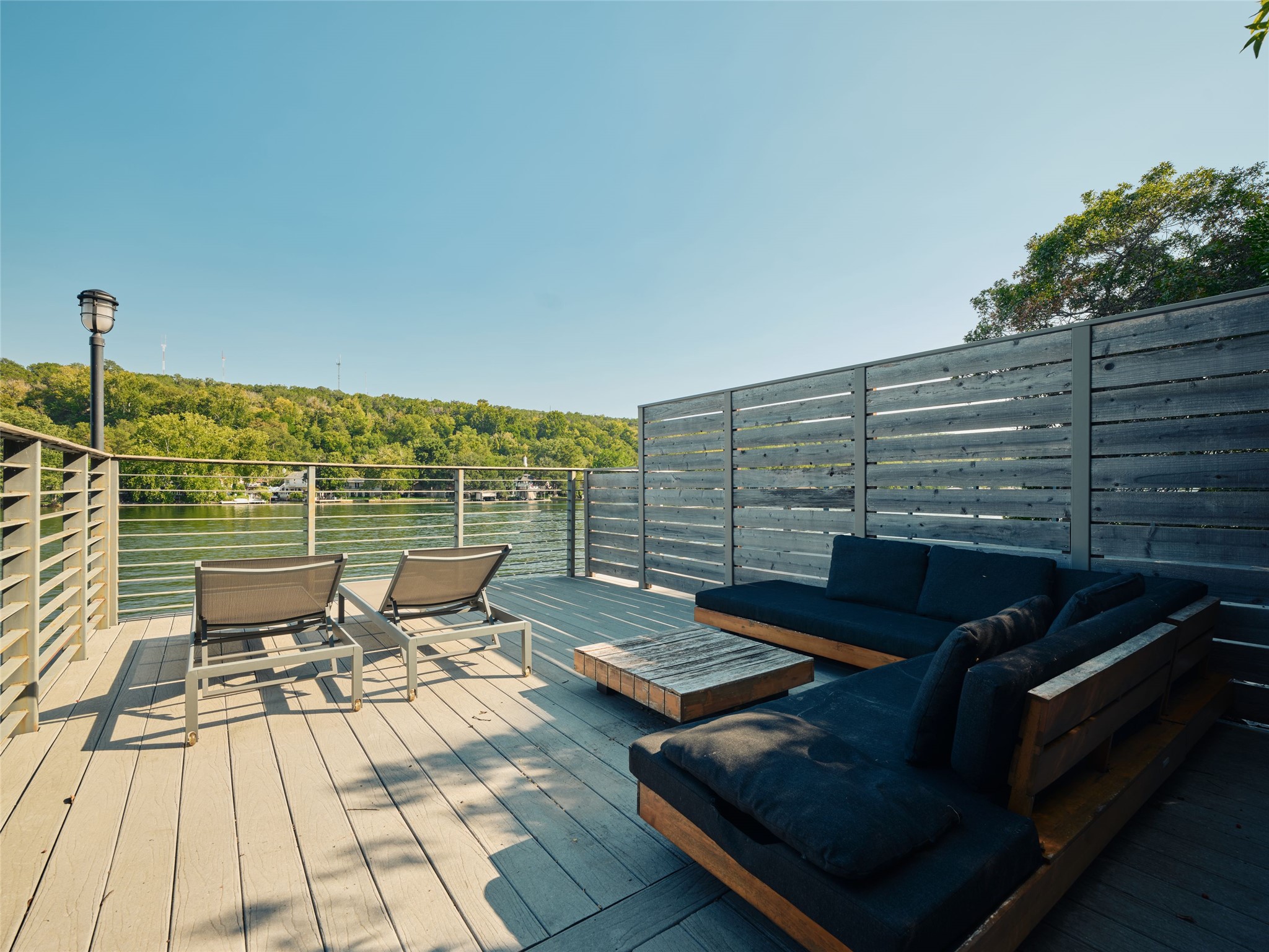 3214 Smoky Ridge, Unit LOT A Austin, TX 78730 - Photo 6 of 32 a roof deck with outdoor seating and city view