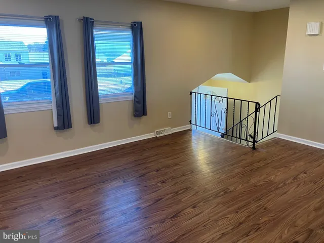a view of entryway with wooden floor