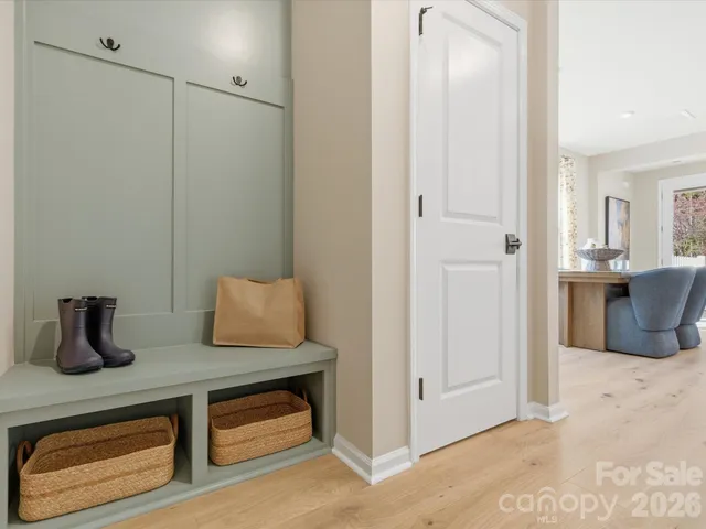 a kitchen with a refrigerator and cabinets