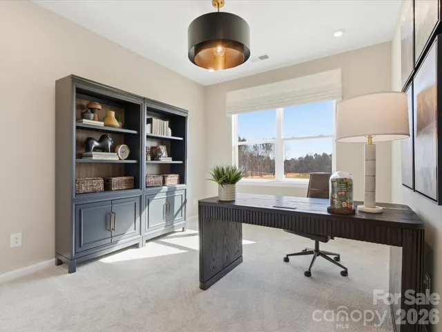 a view of workspace with a window and cabinet