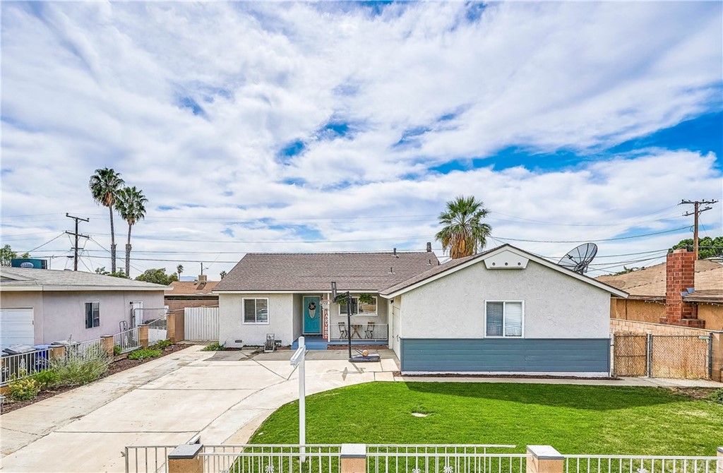 571 East Merrill Avenue Rialto, CA 92376 - Photo 1 of 1 a front view of a house with a garden