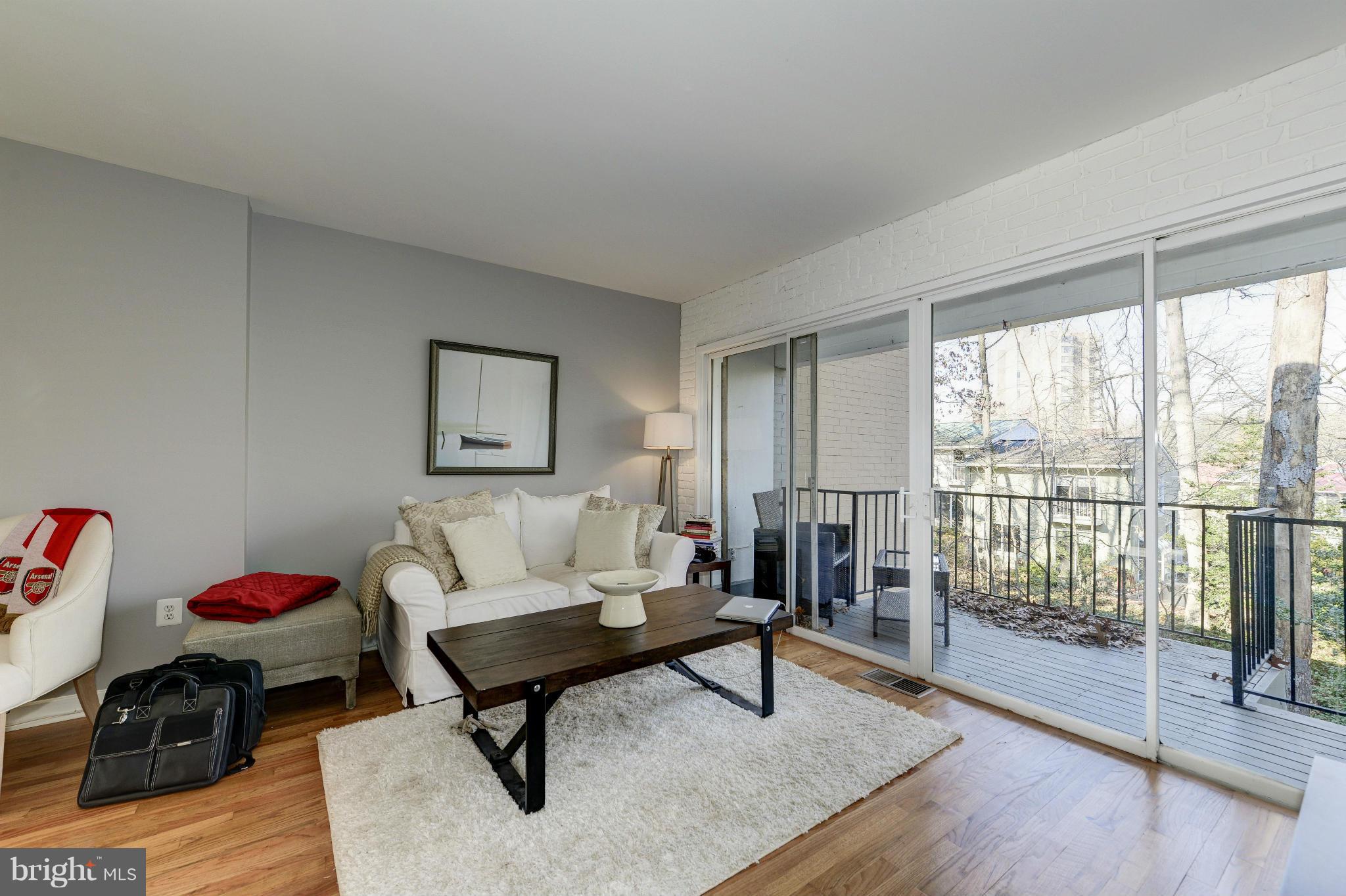 11475 Waterview Cluster Reston, VA 20190 - Photo 13 of 25 a living room with furniture and a window