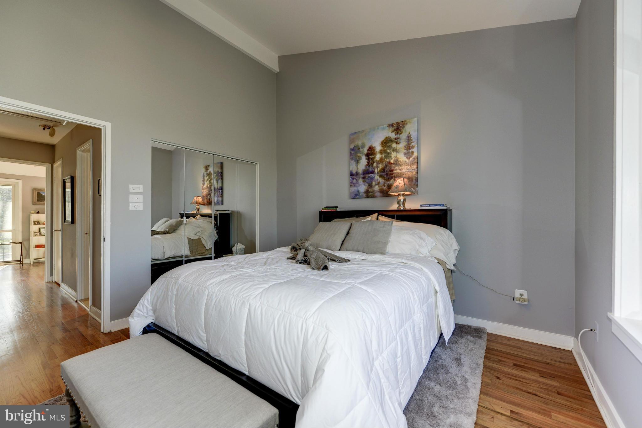 11475 Waterview Cluster Reston, VA 20190 - Photo 20 of 25 a bedroom with a bed and wooden floor