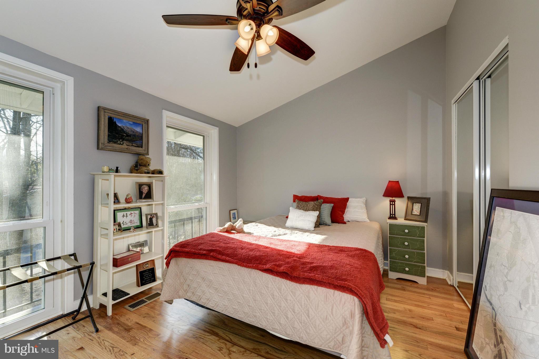 11475 Waterview Cluster Reston, VA 20190 - Photo 23 of 25 a bedroom with a bed and a book shelf