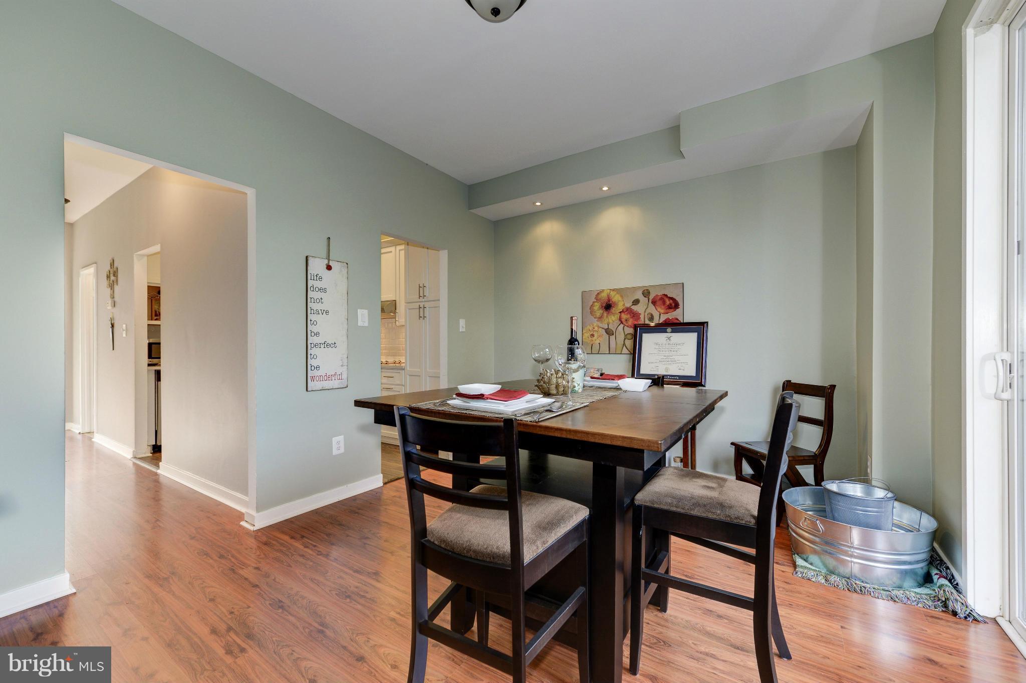 11475 Waterview Cluster Reston, VA 20190 - Photo 7 of 25 a view of a dining room with furniture and wooden floor