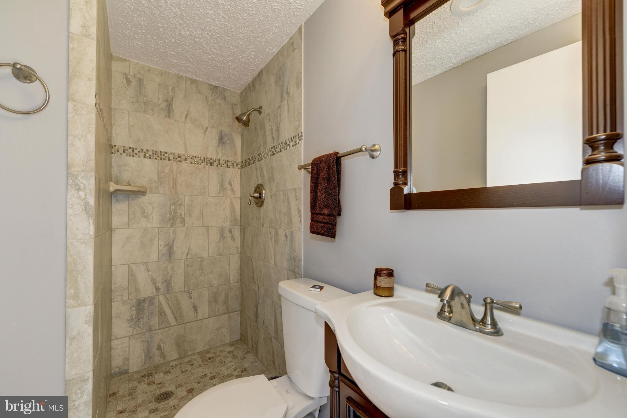 11475 Waterview Cluster Reston, VA 20190 - Photo 10 of 25 a bathroom with a sink toilet and shower