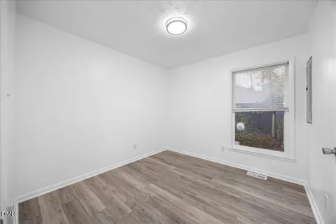 a kitchen with stainless steel appliances granite countertop a stove sink and cabinets