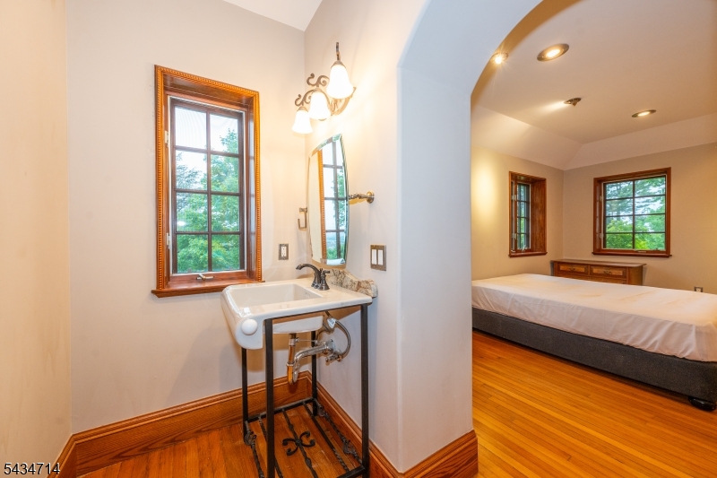 50 Rock Spring Road West Orange, NJ 07052 - Photo 32 of 50 a bedroom with a bed and a table
