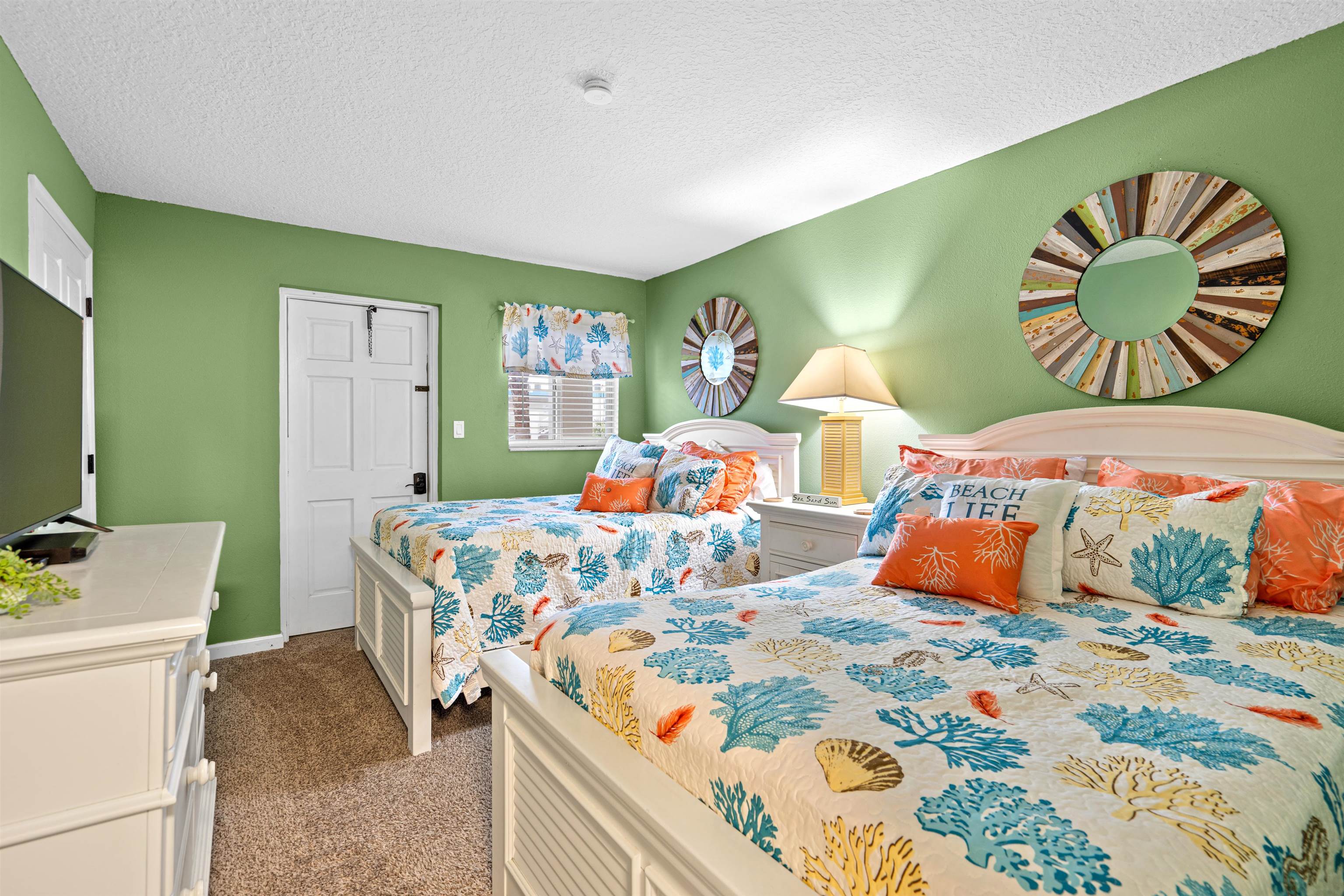 1 Ocean Trace Road, Unit 232 St. Augustine, FL 32080 - Photo 15 of 49 a bedroom with two beds and painting on the wall