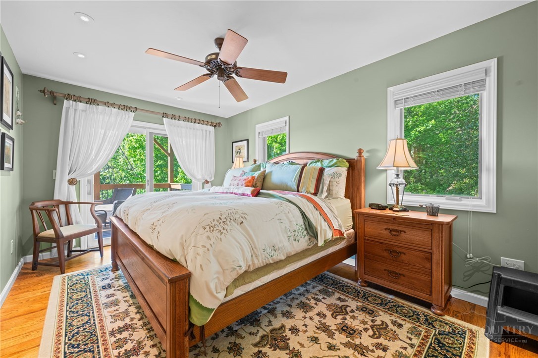 331 Alpine Road Blowing Rock, NC 28605 - Photo 37 of 50 a bed sitting in a bedroom next to a window