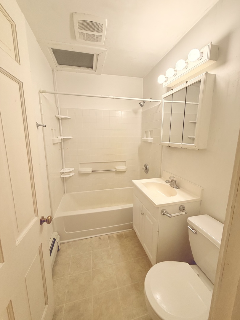 134 West State Street Sycamore, IL 60178 - Photo 36 of 43 a bathroom with a sink a toilet and shower