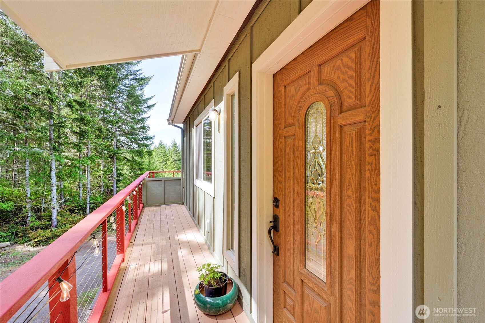 83 Octopus Court Quilcene, WA 98376 - Photo 7 of 40 a balcony with a table and chairs