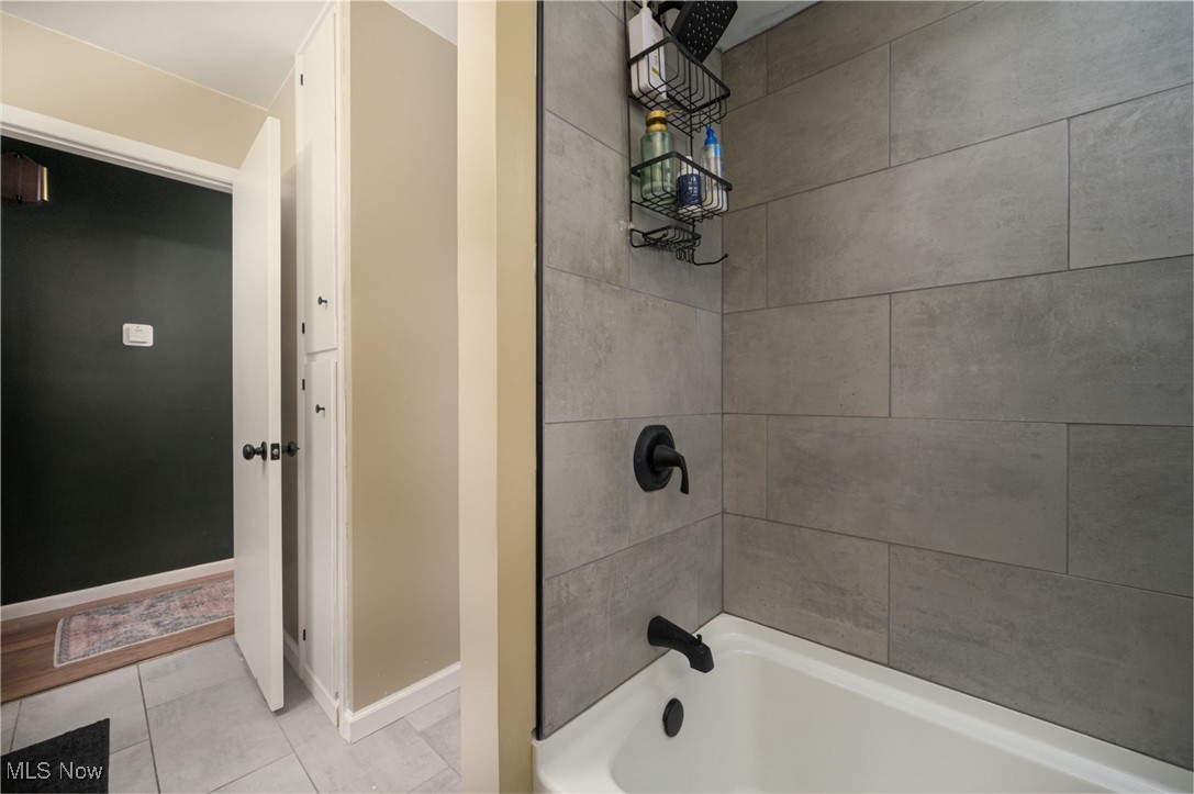 1177 Munroe Falls Kent Road Kent, OH 44240 - Photo 39 of 47 Bathroom featuring tile patterned flooring and tiled shower / bath
