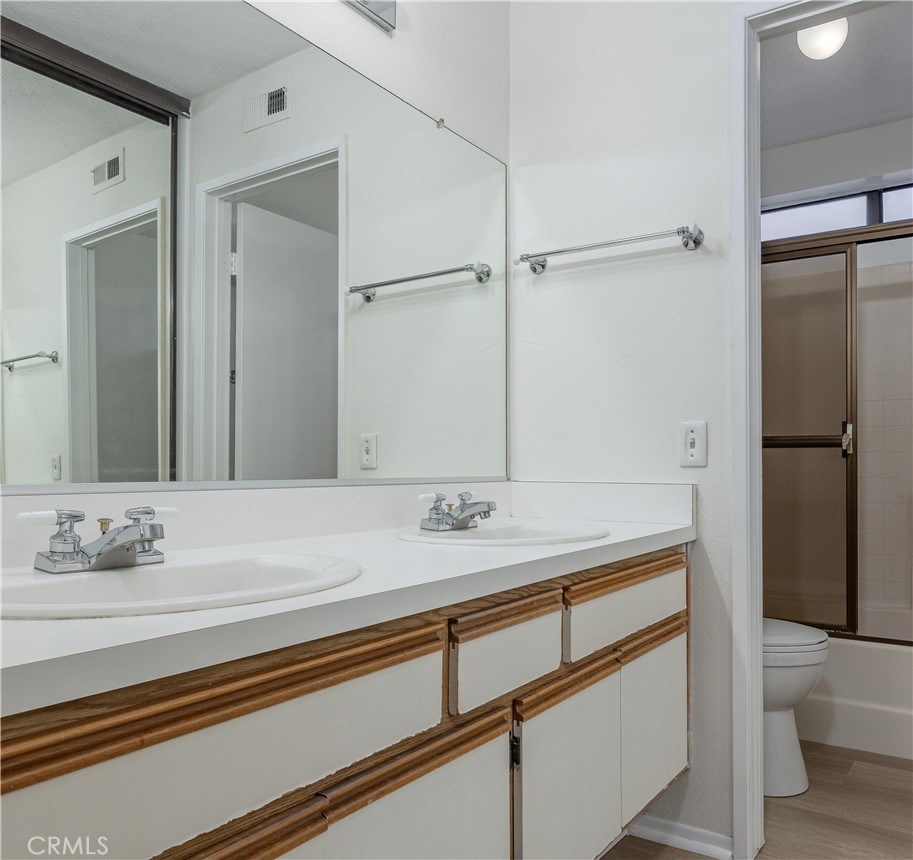 305 Huntington Irvine, CA 92620 - Photo 19 of 35 a bathroom with a sink and a mirror