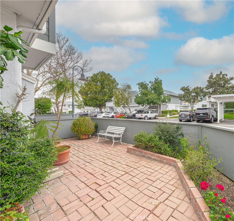 305 Huntington Irvine, CA 92620 - Photo 31 of 35 a view of a lake with a bench and a lawn chairs