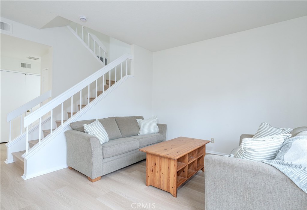305 Huntington Irvine, CA 92620 - Photo 8 of 35 a living room with furniture and a stairs