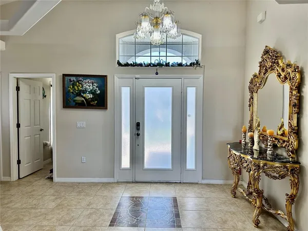 a view of a hallway with a chandelier