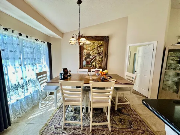 a living room with a bed furniture and a rug