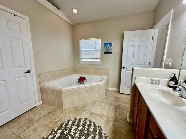 a view of a livingroom with wooden floor and a cabinet