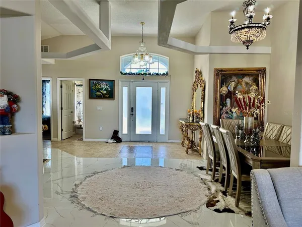 a view of a livingroom with fireplace and furniture