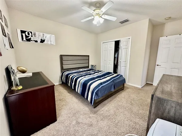 a bedroom with a bed and a table