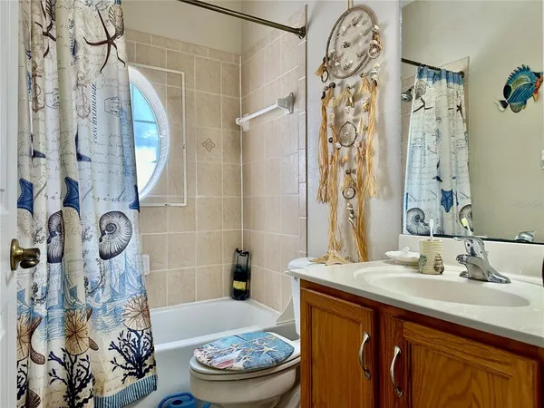 a bedroom with bed and window