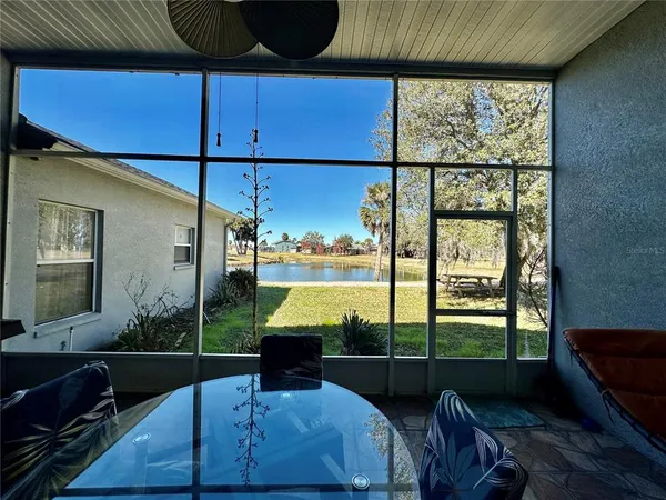 a living room with furniture a dining table and chairs