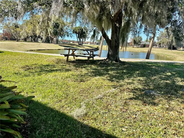 a view of a lake with outdoor seating