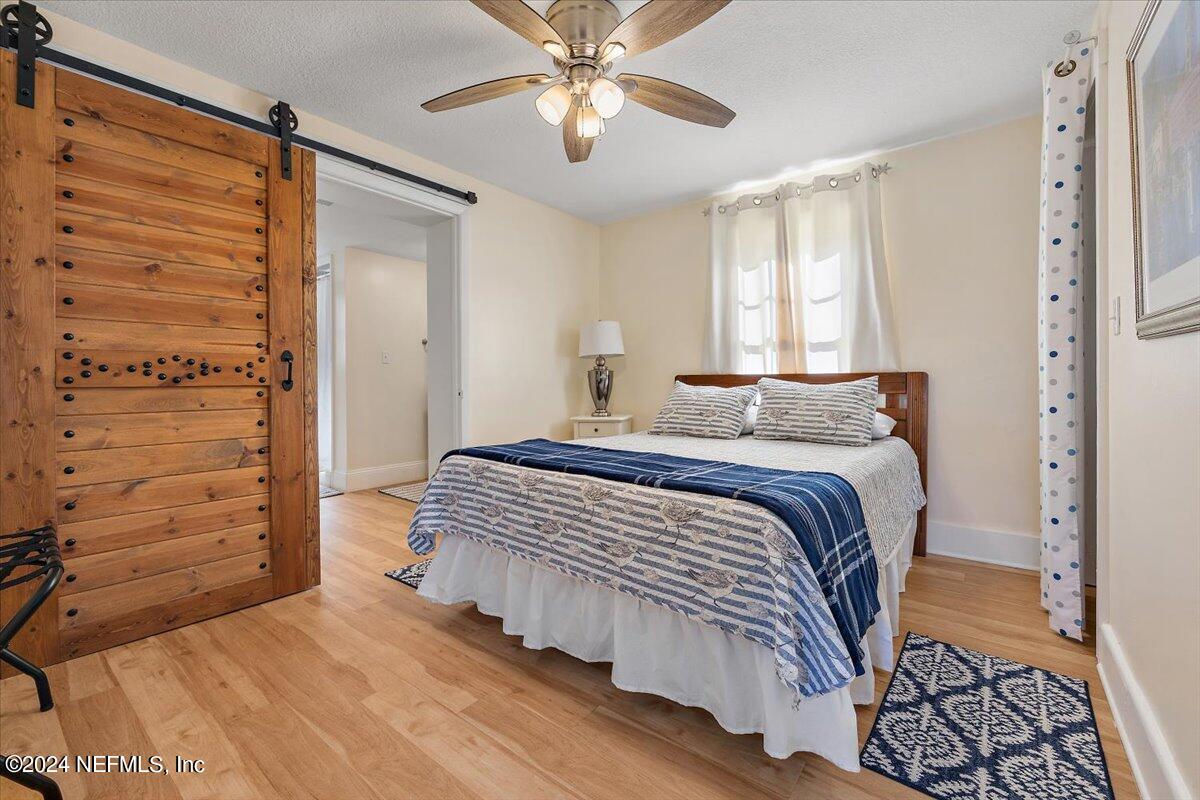 2610 Pacetti Road, Unit A St. Augustine, FL 32092 - Photo 12 of 31 a bedroom with a bed and a window