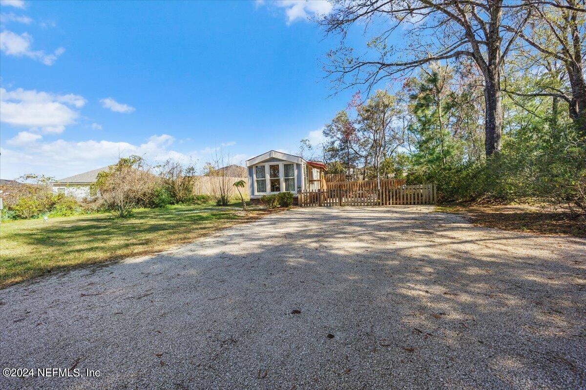 2610 Pacetti Road, Unit A St. Augustine, FL 32092 - Photo 17 of 31 a view of a house with a yard