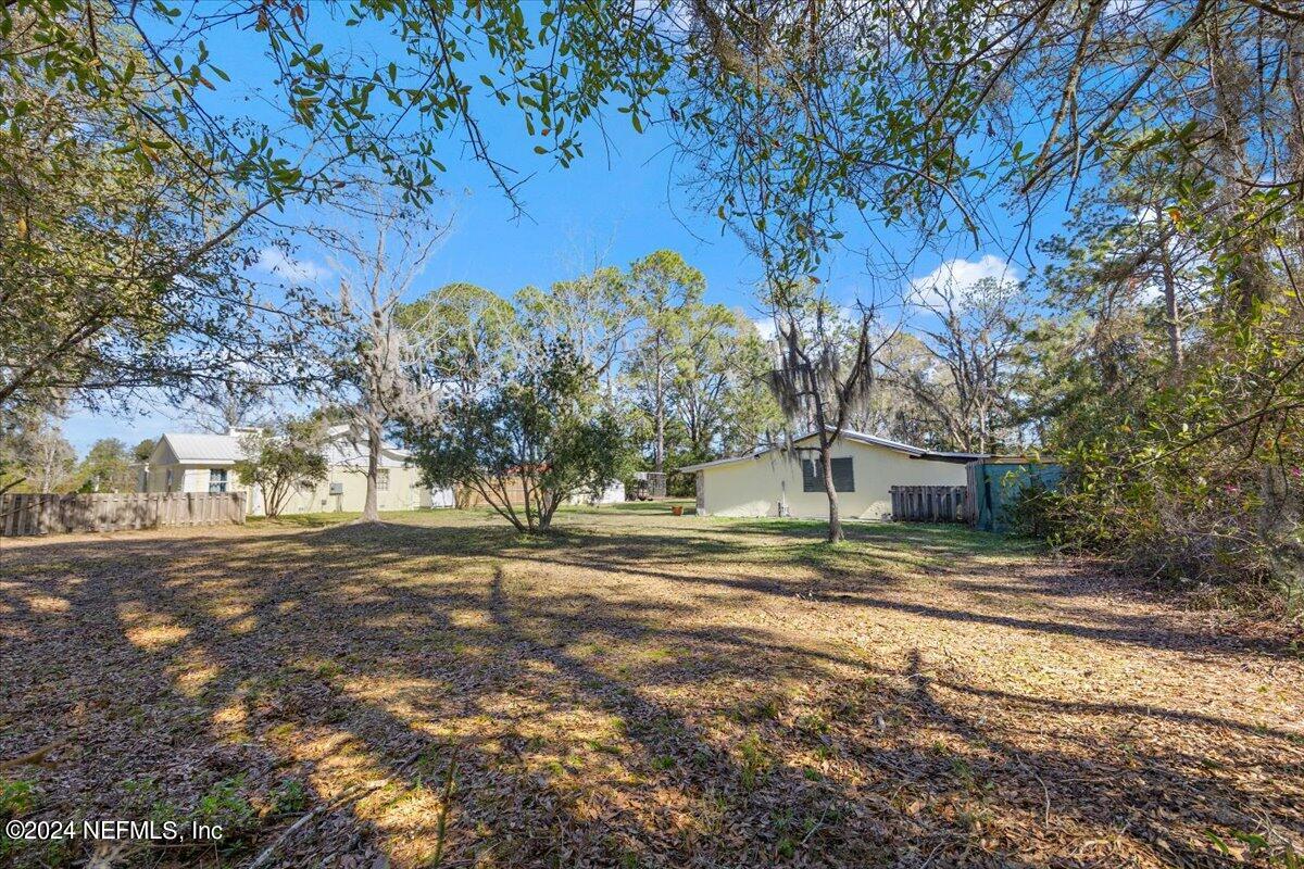2610 Pacetti Road, Unit A St. Augustine, FL 32092 - Photo 2 of 31 a view of road and trees