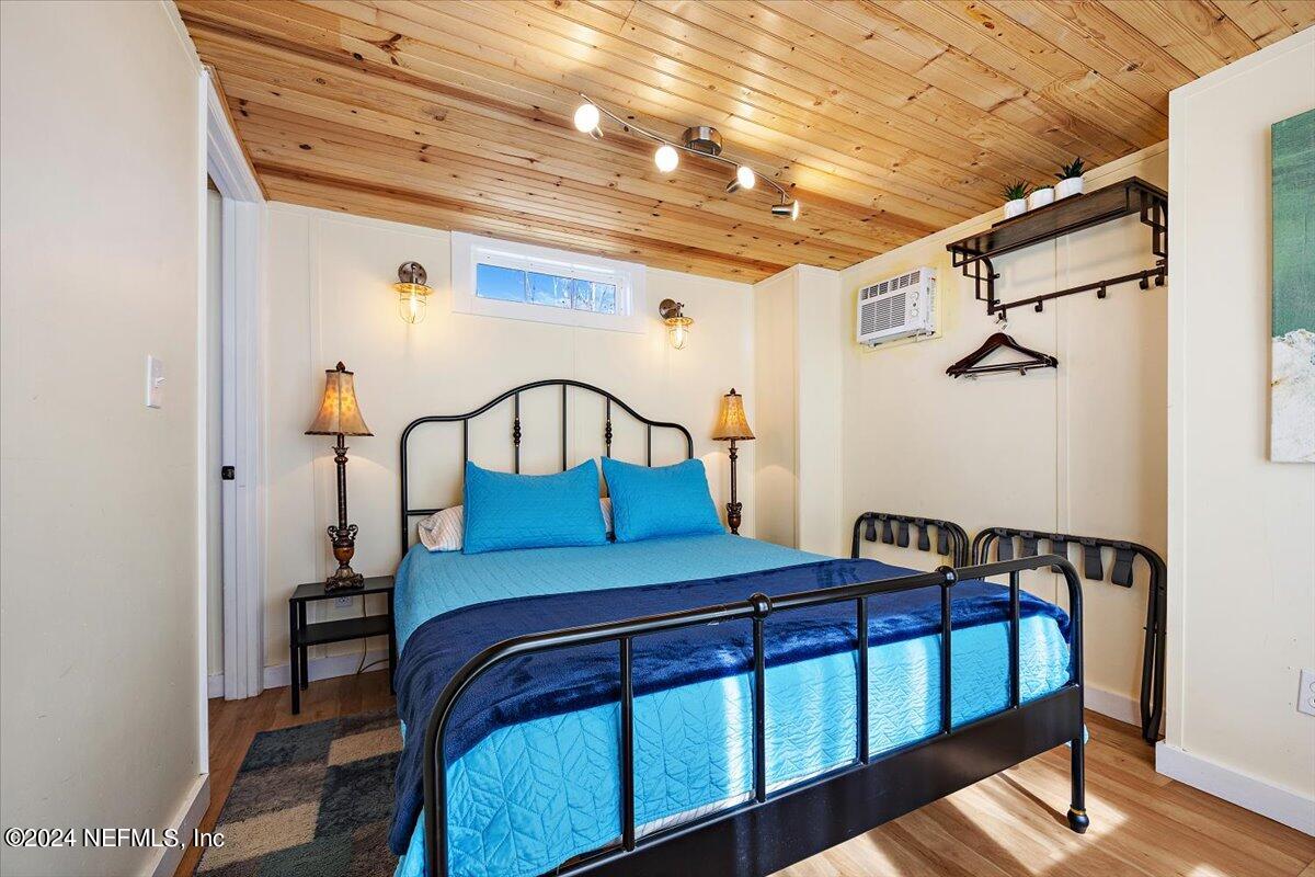 2610 Pacetti Road, Unit A St. Augustine, FL 32092 - Photo 22 of 31 a bedroom with a bed a desk and chair