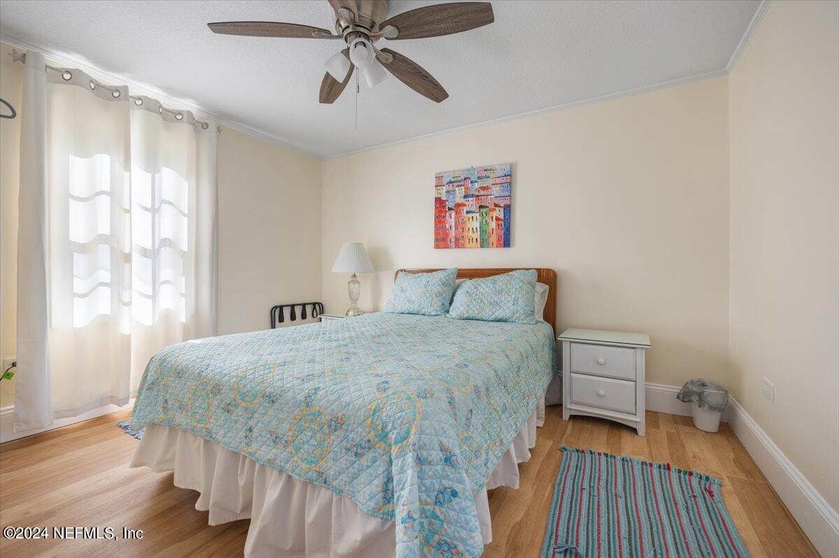 2610 Pacetti Road, Unit A St. Augustine, FL 32092 - Photo 23 of 31 a bedroom with a bed and a window