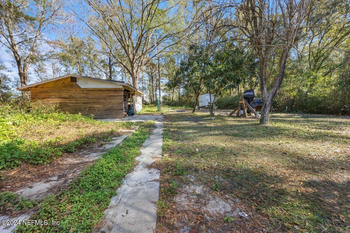 2610 Pacetti Road, Unit A St. Augustine, FL 32092 - Photo 27 of 31 a view of a yard with an trees