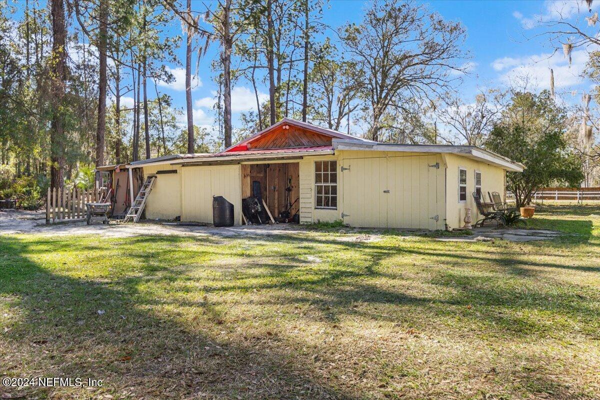2610 Pacetti Road, Unit A St. Augustine, FL 32092 - Photo 28 of 31 a view of a house with a yard