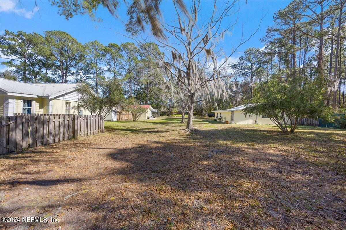2610 Pacetti Road, Unit A St. Augustine, FL 32092 - Photo 3 of 31 a view of road with large trees