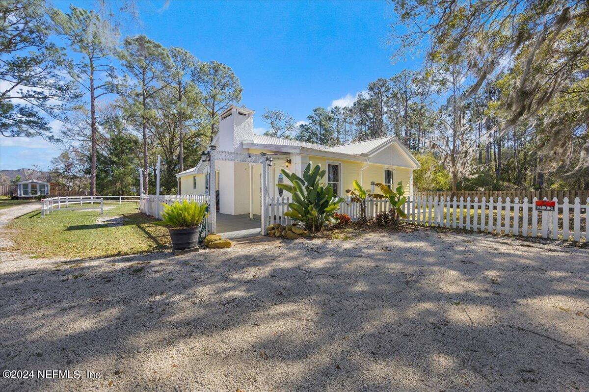 2610 Pacetti Road, Unit A St. Augustine, FL 32092 - Photo 4 of 31 a view of a house with backyard and sitting area