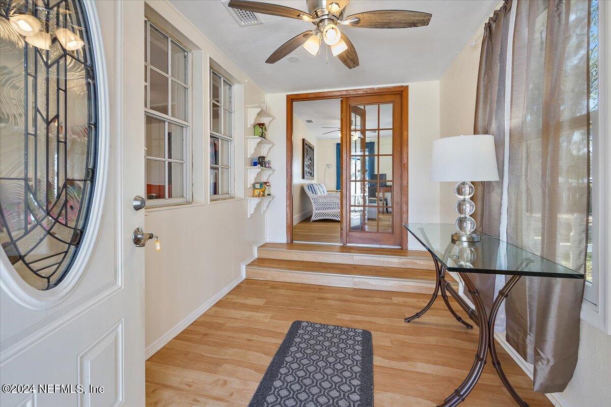 2610 Pacetti Road, Unit A St. Augustine, FL 32092 - Photo 6 of 31 a view of a hallway with paintings on the wall