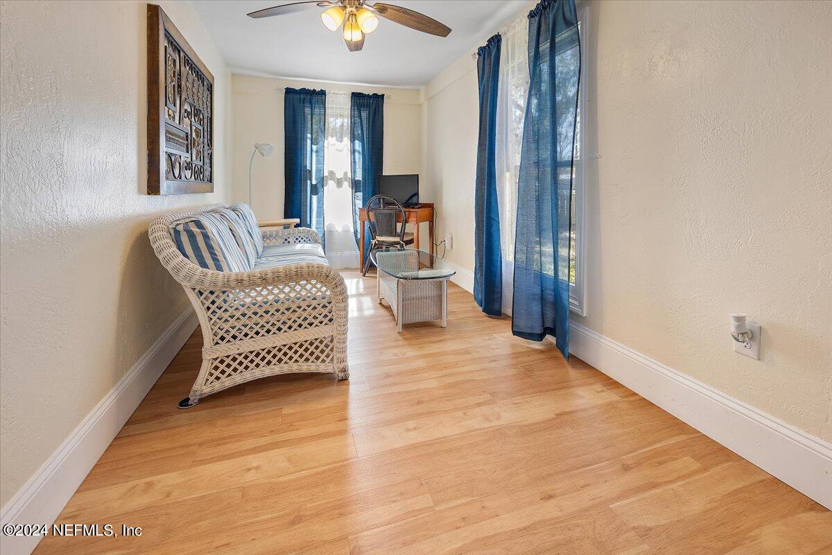 2610 Pacetti Road, Unit A St. Augustine, FL 32092 - Photo 7 of 31 a living room with furniture and a wooden floor